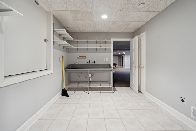 laundry room with electric dryer hookup, light tile patterned floors, and hookup for a washing machine