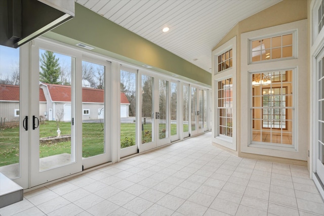 unfurnished sunroom with wooden ceiling, a chandelier, and lofted ceiling