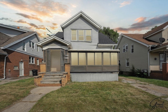 view of front of home with a lawn