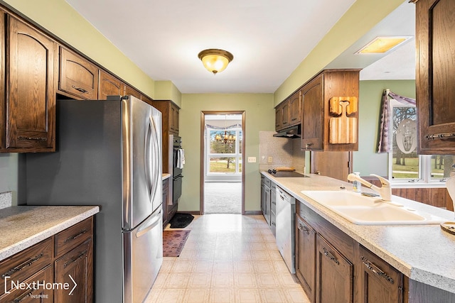 kitchen with black appliances and sink