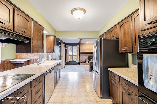 kitchen with sink and black appliances