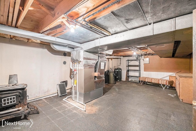 basement with a wood stove and heating unit