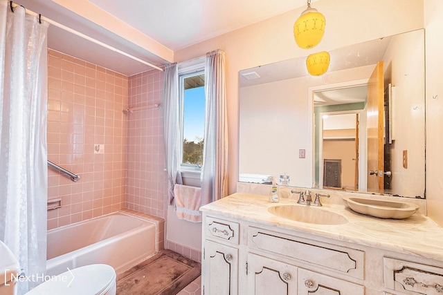 full bathroom featuring vanity, shower / bath combination with curtain, and toilet