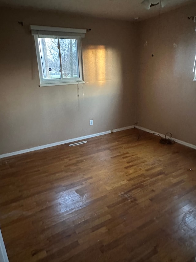 empty room featuring dark hardwood / wood-style floors