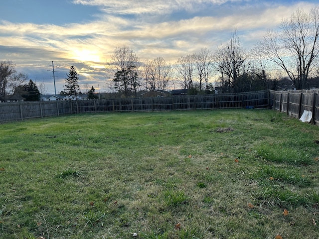 view of yard at dusk