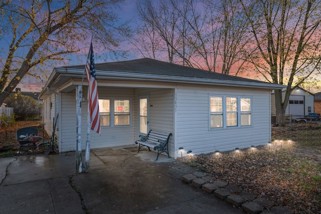 bungalow-style home with a patio area