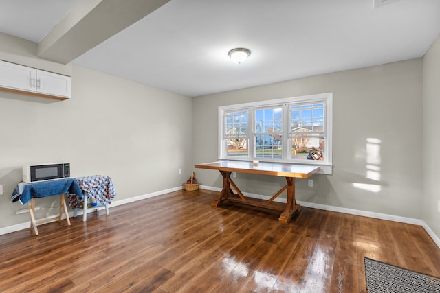 miscellaneous room with dark wood-type flooring