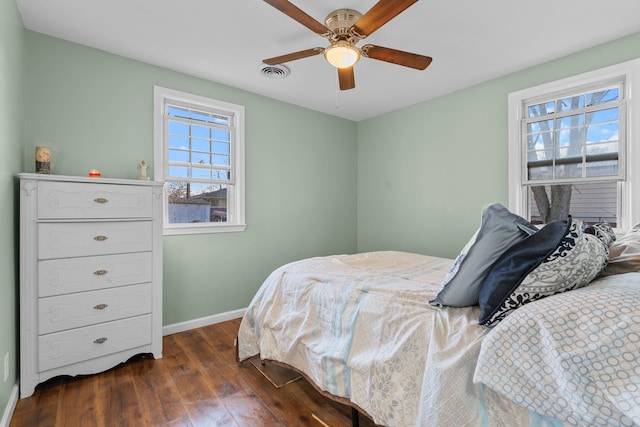 bedroom featuring ceiling fan and dark hardwood / wood-style flooring