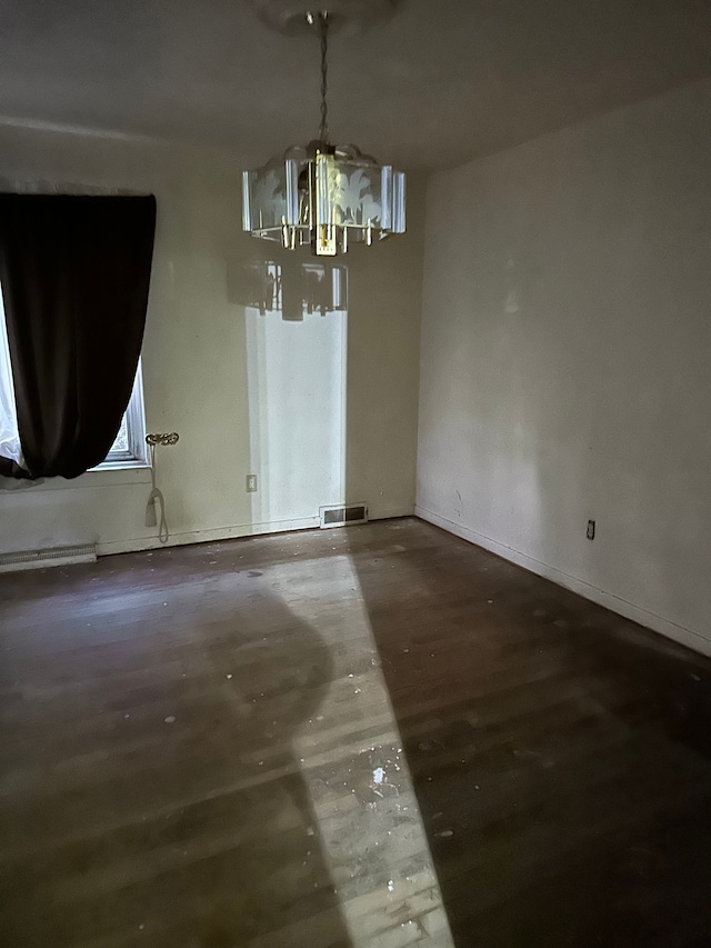 unfurnished dining area featuring hardwood / wood-style flooring