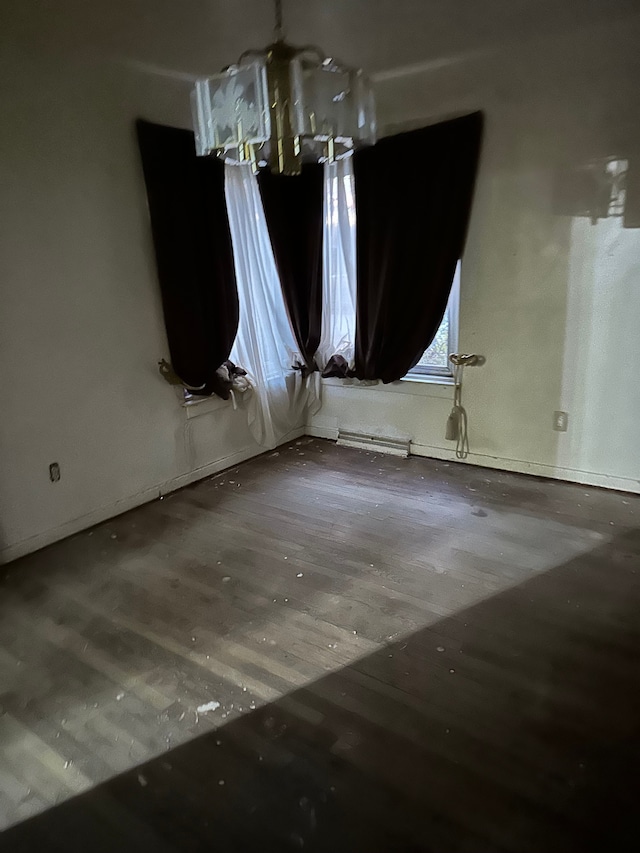 unfurnished room with hardwood / wood-style floors