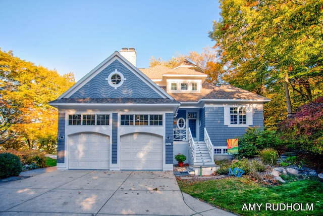 1749 Sunset Point Dr, Norton Shores, MI 49441 - view of front of property featuring a chimney, a garage, and driveway