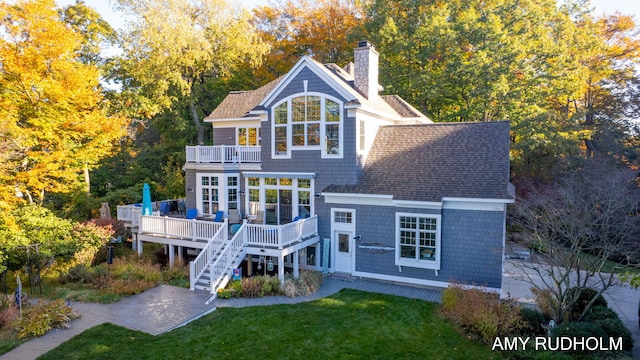 1749 Sunset Point Dr, Norton Shores, MI 49441 - rear view of property featuring a balcony, a yard, a chimney, a deck, and stairway