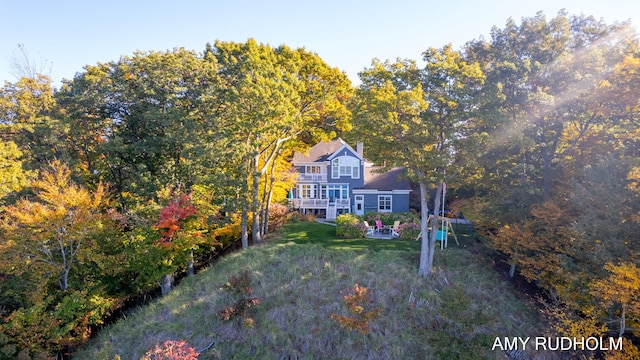 1749 Sunset Point Dr, Norton Shores, MI 49441 - view of front of home with a front yard and a patio area