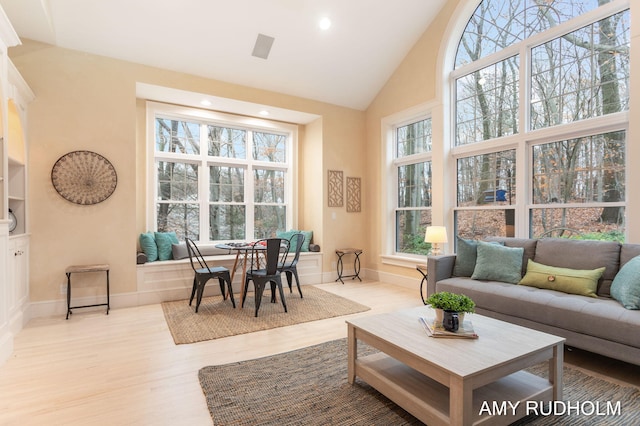 1749 Sunset Point Dr, Norton Shores, MI 49441 - living room with high vaulted ceiling, light wood-type flooring, baseboards, and recessed lighting