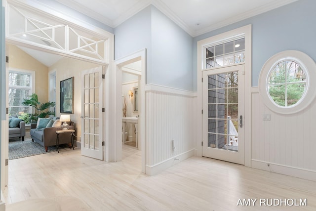 1749 Sunset Point Dr, Norton Shores, MI 49441 - foyer entrance featuring wood finished floors, a wainscoted wall, french doors, and crown molding