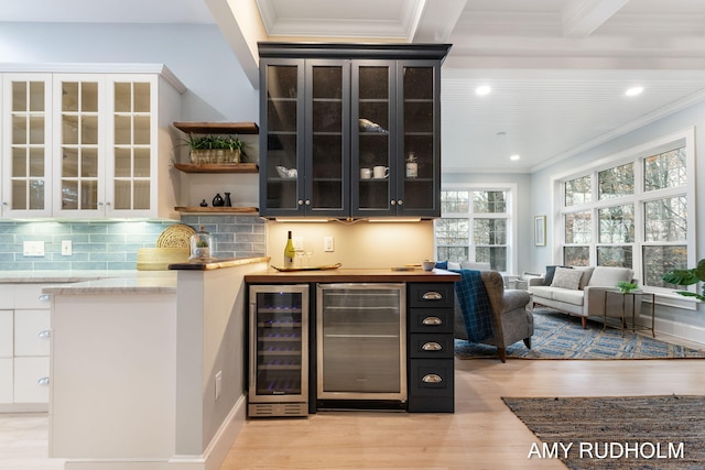 1749 Sunset Point Dr, Norton Shores, MI 49441 - indoor bar featuring wine cooler, crown molding, light wood-type flooring, backsplash, and recessed lighting