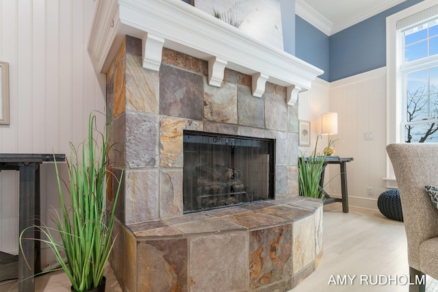 1749 Sunset Point Dr, Norton Shores, MI 49441 - detailed view of a tile fireplace, ornamental molding, wood finished floors, and a decorative wall