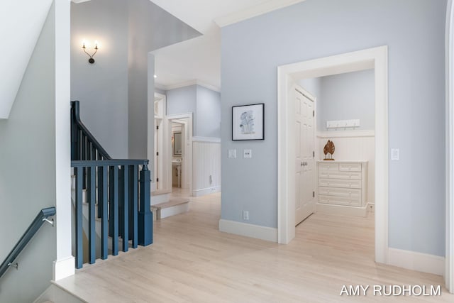 1749 Sunset Point Dr, Norton Shores, MI 49441 - hallway featuring an upstairs landing, wood finished floors, baseboards, and crown molding
