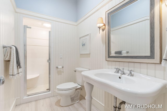 1749 Sunset Point Dr, Norton Shores, MI 49441 - full bath with a shower stall, toilet, and wood finished floors