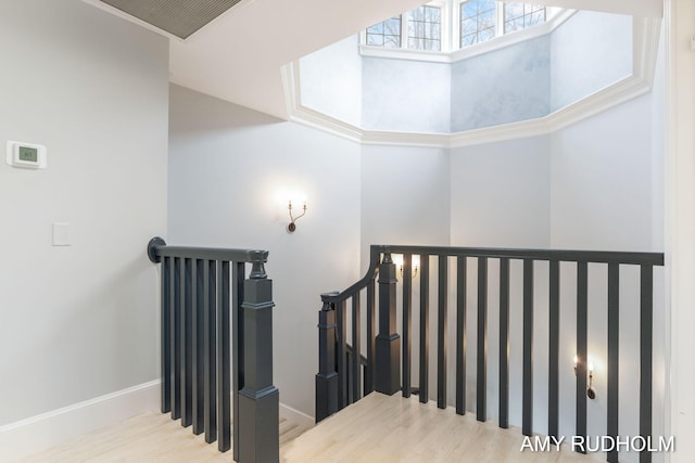1749 Sunset Point Dr, Norton Shores, MI 49441 - staircase with wood finished floors and baseboards