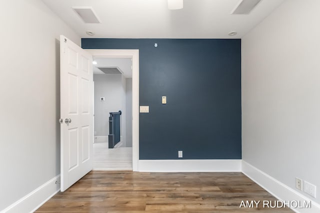 1749 Sunset Point Dr, Norton Shores, MI 49441 - unfurnished room featuring baseboards and wood finished floors