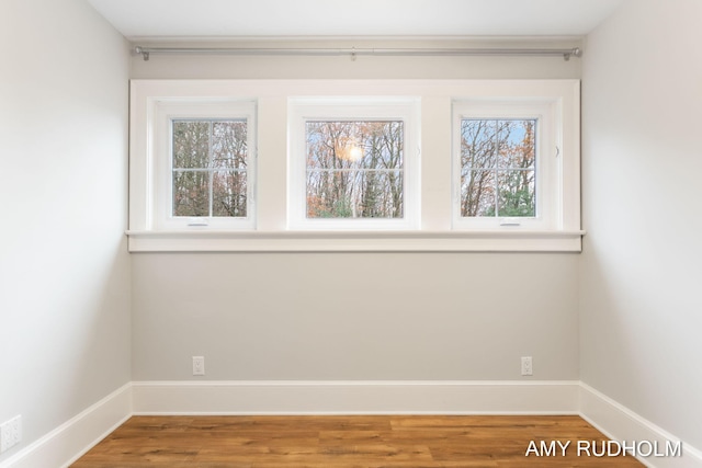 1749 Sunset Point Dr, Norton Shores, MI 49441 - unfurnished room featuring wood finished floors and baseboards