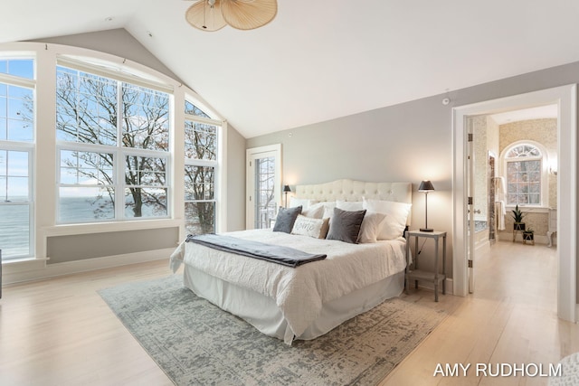 1749 Sunset Point Dr, Norton Shores, MI 49441 - bedroom with light wood-style flooring, high vaulted ceiling, and baseboards