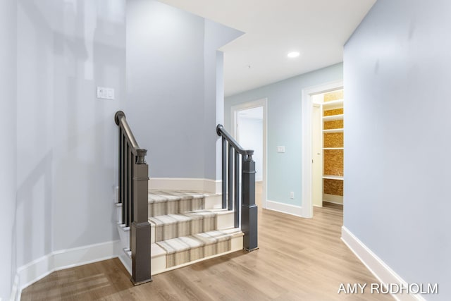 1749 Sunset Point Dr, Norton Shores, MI 49441 - stairs featuring wood finished floors, baseboards, and recessed lighting