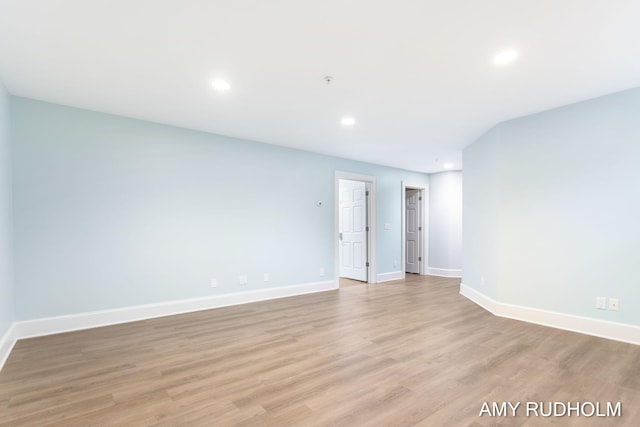 1749 Sunset Point Dr, Norton Shores, MI 49441 - unfurnished room featuring baseboards, light wood-type flooring, and recessed lighting