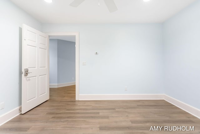 1749 Sunset Point Dr, Norton Shores, MI 49441 - unfurnished room featuring baseboards, light wood-style floors, a ceiling fan, and recessed lighting
