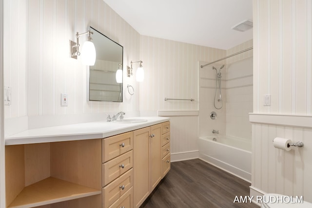 1749 Sunset Point Dr, Norton Shores, MI 49441 - full bath featuring wood finished floors, vanity, and  shower combination