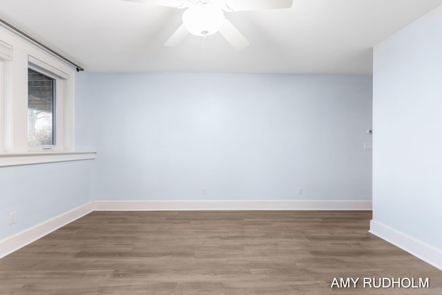 1749 Sunset Point Dr, Norton Shores, MI 49441 - spare room with light wood-style flooring, baseboards, and ceiling fan