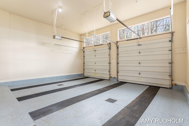 1749 Sunset Point Dr, Norton Shores, MI 49441 - garage with baseboards and a garage door opener