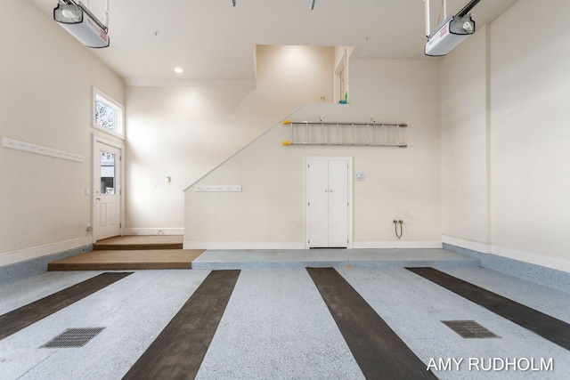 1749 Sunset Point Dr, Norton Shores, MI 49441 - garage featuring baseboards