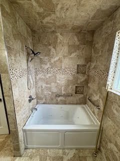 bathroom with shower / bathtub combination