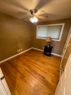 unfurnished room with hardwood / wood-style floors and ceiling fan