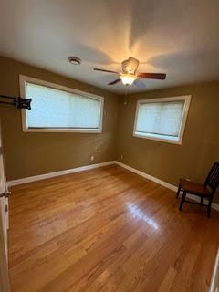 unfurnished bedroom featuring light hardwood / wood-style flooring and multiple windows