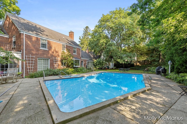 view of pool with a patio area