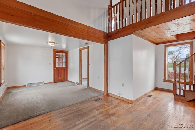 interior space featuring light hardwood / wood-style floors and wood ceiling