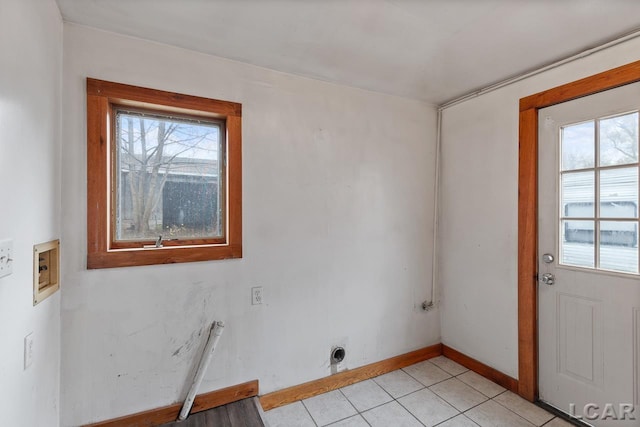 clothes washing area featuring washer hookup, light tile patterned floors, and electric dryer hookup