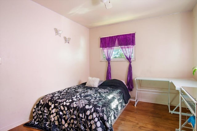 bedroom featuring ceiling fan and hardwood / wood-style flooring