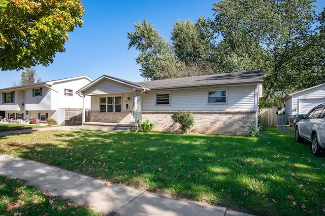 view of front of house featuring covered porch and a front yard