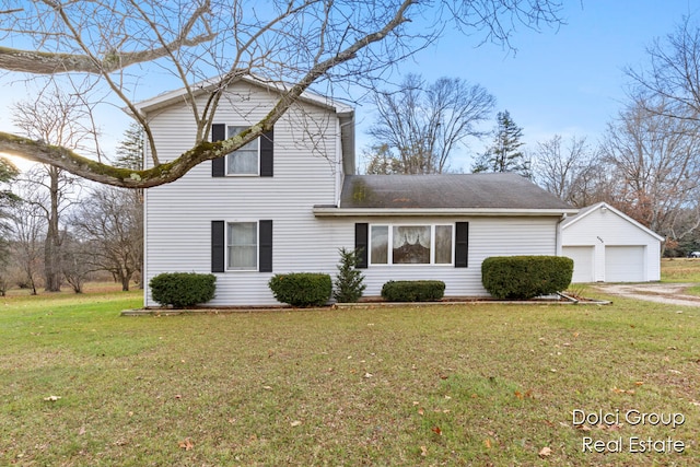 view of property with a garage and a front lawn