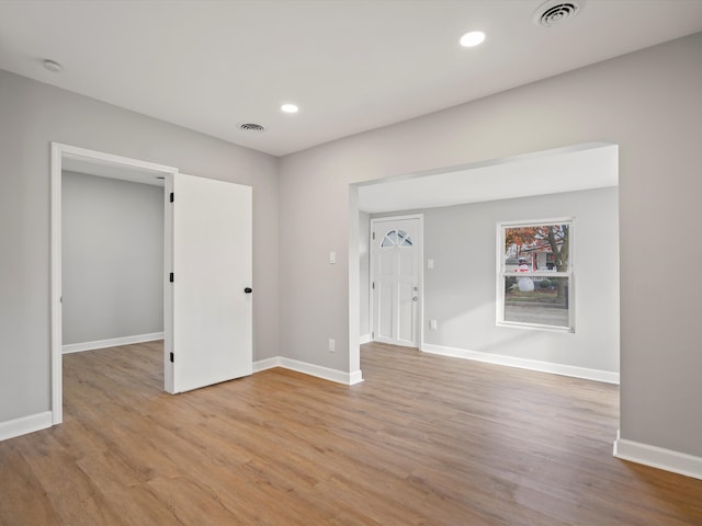 spare room with light hardwood / wood-style floors