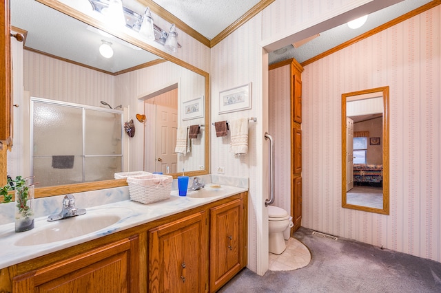 bathroom with vanity, crown molding, toilet, a textured ceiling, and an enclosed shower