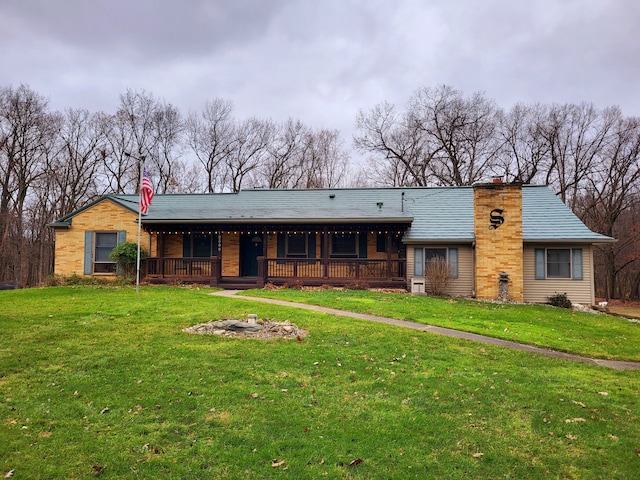 back of property featuring a yard