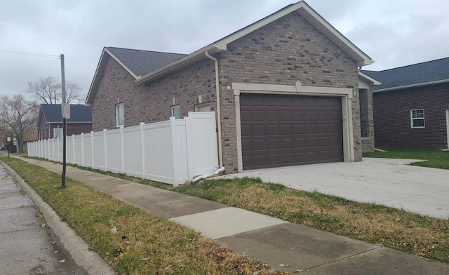 view of side of home featuring a garage