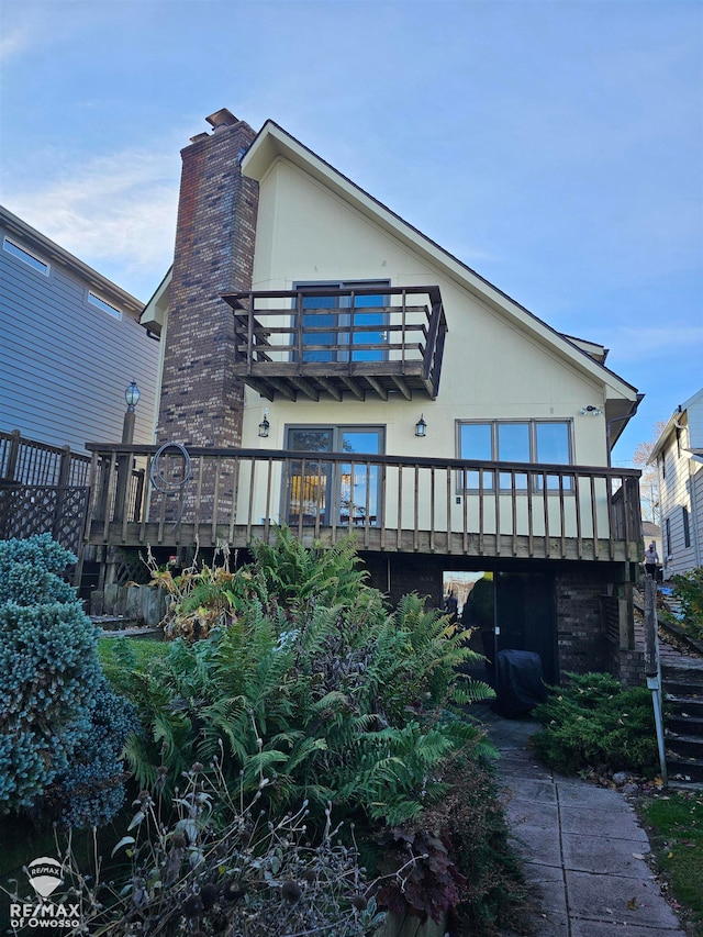 rear view of house with a balcony