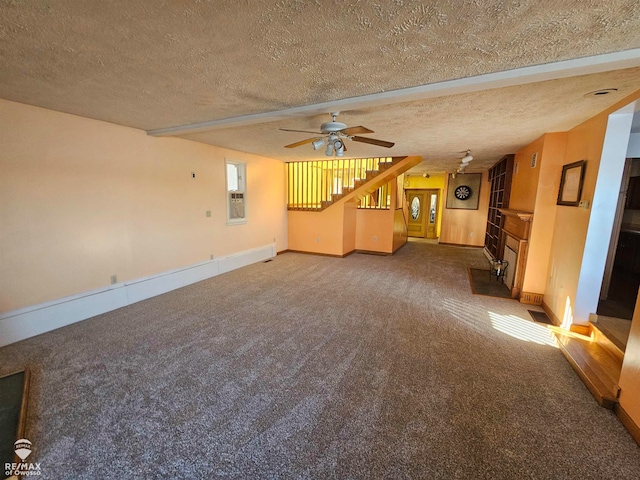 unfurnished living room with ceiling fan, carpet, and a textured ceiling