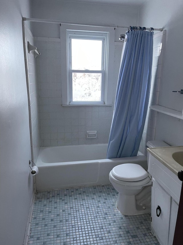 full bathroom featuring tile patterned floors, vanity, shower / bath combo, and toilet